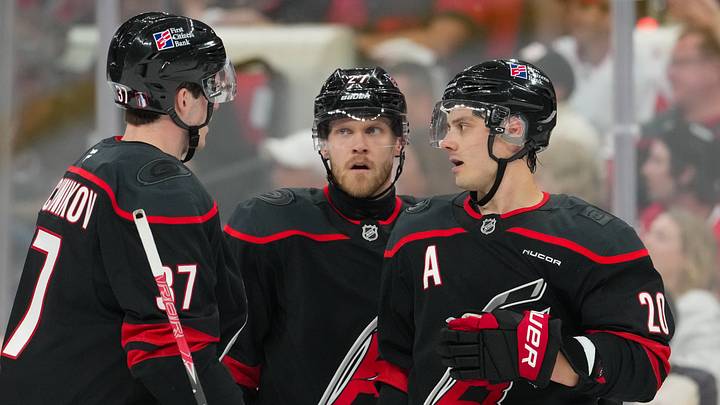 Apr 18, 2026; Raleigh, North Carolina, USA; Carolina Hurricanes center Sebastian Aho (20), left wing Nikolaj Ehlers (27), and right wing Andrei Svechnikov (37) talk against the Ottawa Senators during the third period in game one of the first round of the 2026 Stanley Cup Playoffs at Lenovo Center. Mandatory Credit: James Guillory-Imagn Images Apr 18, 2026; Raleigh, North Carolina, USA; Carolina Hurricanes center Sebastian Aho (20), left wing Nikolaj Ehlers (27), and right wing Andrei Svechnikov (37) talk against the Ottawa Senators during the third period in game one of the first round of the 2026 Stanley Cup Playoffs at Lenovo Center. Mandatory Credit: James Guillory-Imagn Images