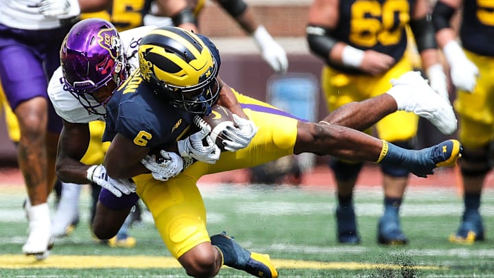 Michigan wide receiver Cornelius Johnson makes a catch against East Carolina defensive back Shavon Revel during the second half of U-M's 30-3 win on Saturday, Sept. 2, 2023, at Michigan Stadium.