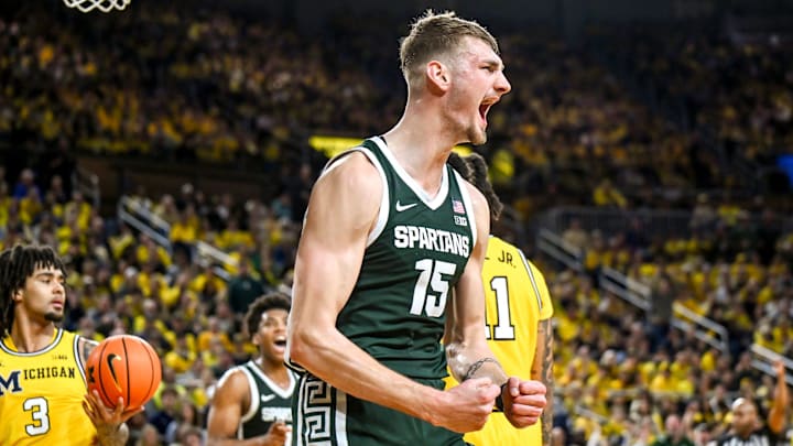 Michigan State's Carson Cooper celebrates after a scoring and drawing a Michigan foul during the second half on Sunday, March 8, 2026, at the Crisler Center in Ann Arbor.