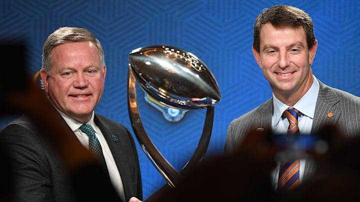 Notre Dame head coach Brian Kelly and Clemson head coach Dabo Swinney shake hands in front of the Cotton Bowl trophy after the head coaches press conference Friday, December 28, 2018.

Cotton Bowl Head Coaches Press Conference