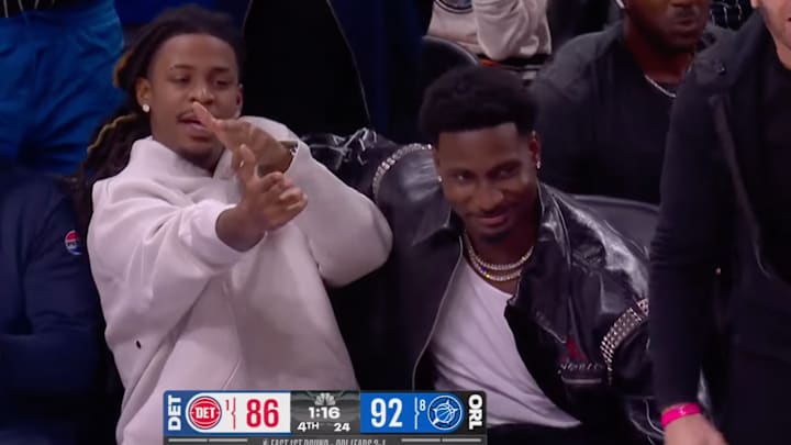 Ja Morant and Jaren Jackson Jr. celebrate a Desmond Bane three-pointer. 