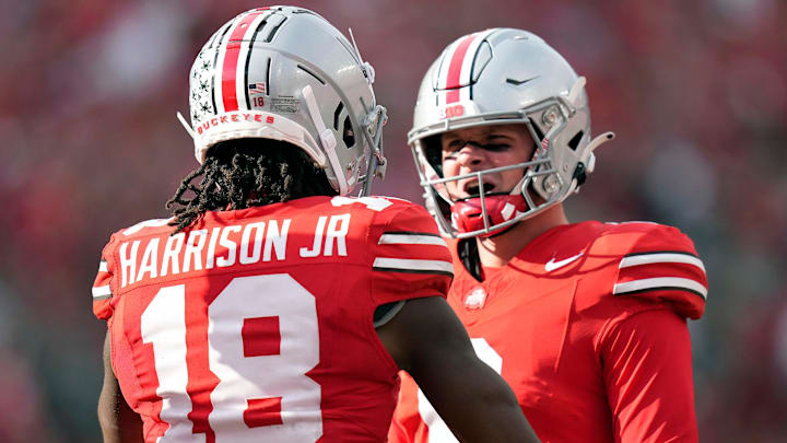 Sep 16, 2023; Columbus, Ohio, USA; Ohio State Buckeyes wide receiver Marvin Harrison Jr. (18) celebrates his touchdown catch with Ohio State Buckeyes quarterback Kyle McCord (6) against Western Kentucky Hilltoppers during the second quarter of their game at Ohio Stadium.
