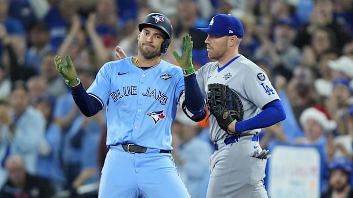 Oct 31, 2025; Toronto, Ontario, CAN; Toronto Blue Jays right fielder George Springer (4) celebrates at first after hitting an RBI single against the Los Angeles Dodgers in the third inning during game six of the 2025 MLB World Series at Rogers Centre. Mandatory Credit: John E. Sokolowski-Imagn Images Oct 31, 2025; Toronto, Ontario, CAN; Toronto Blue Jays right fielder George Springer (4) celebrates at first after hitting an RBI single against the Los Angeles Dodgers in the third inning during game six of the 2025 MLB World Series at Rogers Centre. Mandatory Credit: John E. Sokolowski-Imagn Images