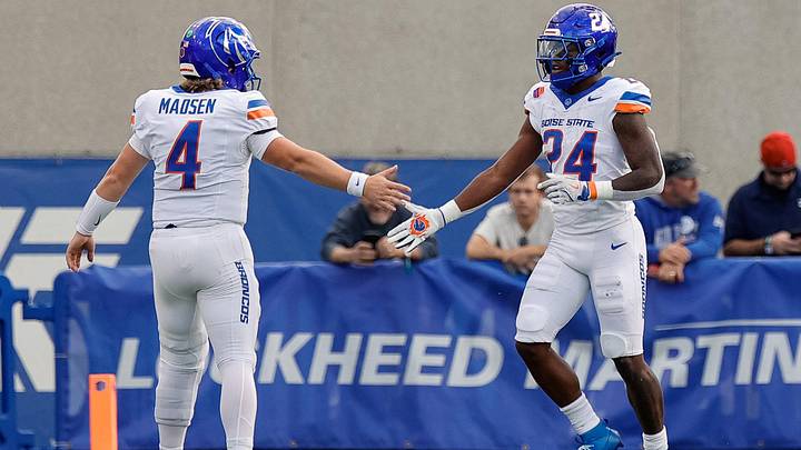 Boise State running back Dylan Riley (24) celebrates with quarterback Maddux Madsen. Boise State running back Dylan Riley (24) celebrates with quarterback Maddux Madsen.