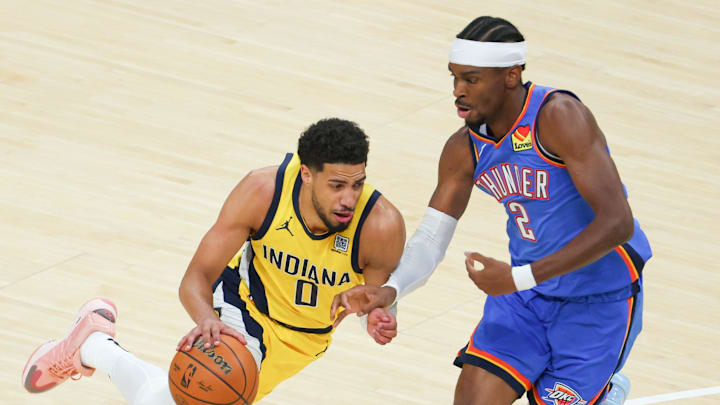 Jun 19, 2025; Indianapolis, Indiana, USA; Indiana Pacers guard Tyrese Haliburton (0) drives to the basket against Oklahoma City Thunder guard Shai Gilgeous-Alexander (2) in the first quarter during game six of the 2025 NBA Finals at Gainbridge Fieldhouse. Mandatory Credit: Trevor Ruszkowski-Imagn Images