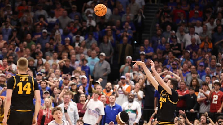 Iowa forward Alvaro Folgueiras (7) shoots the game winning three point shot in the final seconds during the second half of the NCAA March Madness second round at Benchmark international Arena in Tampa, FL on Friday, March 20, 2026. Florida lost 73-72 [Alan Youngblood/Gainesville Sun]