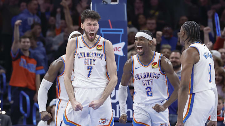Dec 8, 2023; Oklahoma City, Oklahoma, USA; Oklahoma City Thunder forward Chet Holmgren (7), and guard Shai Gilgeous-Alexander (2) celebrate after Chet Holmgren scores a basket against the Golden State Warriors during the second half at Paycom Center. Mandatory Credit: Alonzo Adams-Imagn Images
