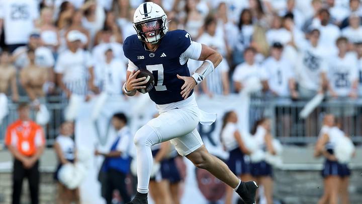 Penn State Nittany Lions quarterback Alex Manske (7) runs with the ball against the Marshall Thundering Herd at Beaver Stadium. Penn State Nittany Lions quarterback Alex Manske (7) runs with the ball against the Marshall Thundering Herd at Beaver Stadium.