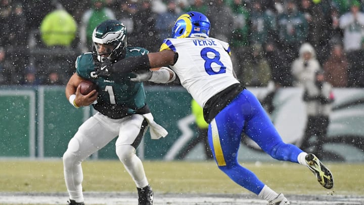 Jan 19, 2025; Philadelphia, Pennsylvania, USA;Los Angeles Rams linebacker Jared Verse (8) sacks Philadelphia Eagles quarterback Jalen Hurts (1) in a 2025 NFC divisional round game at Lincoln Financial Field. Mandatory Credit: Eric Hartline-Imagn Images