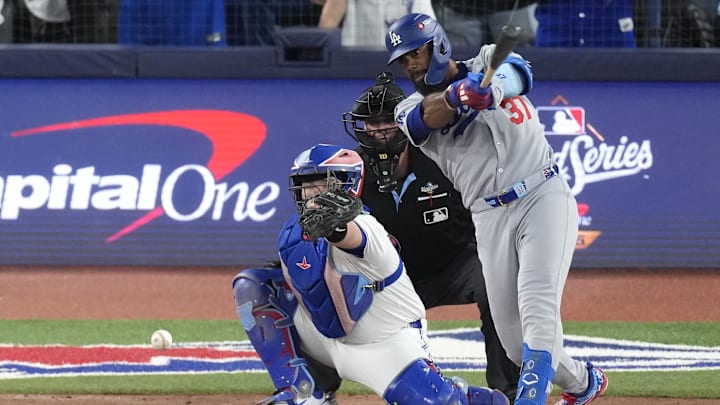 Nov 1, 2025; Toronto, Ontario, CAN; Los Angeles Dodgers right fielder Teoscar Hernandez (37) hits a single against the Toronto Blue Jays in the sixth inning during game seven of the 2025 MLB World Series at Rogers Centre. Mandatory Credit: Kevin Sousa-Imagn Images