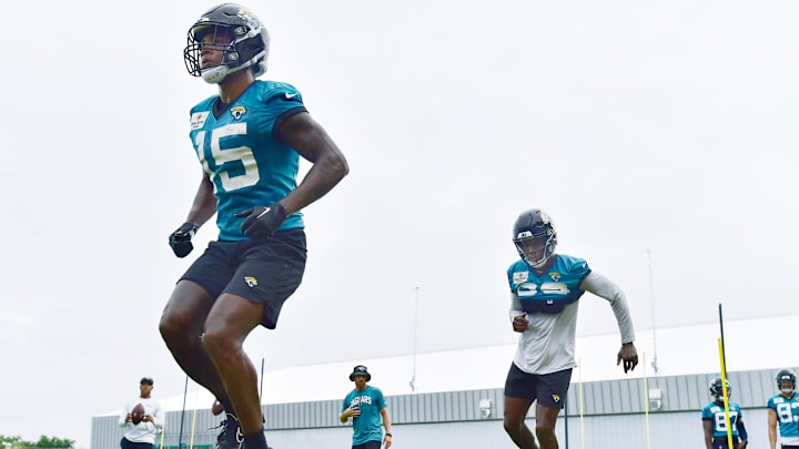 Jacksonville Jaguars wide receiver Tim Jones (15) and teammates go through balance drills during the