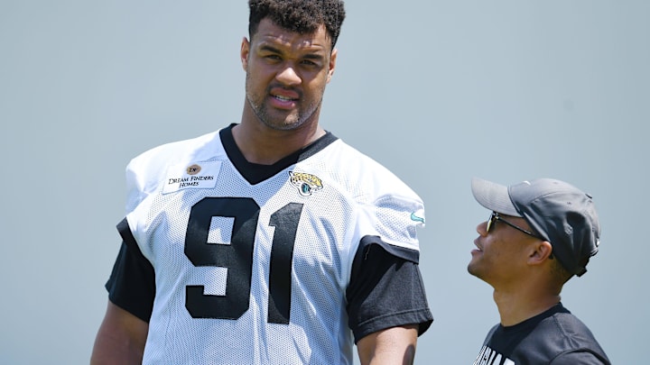 Jaguars director of football communications Dylan Morton talks with Jacksonville Jaguars defensive tackle Arik Armstead (91) Monday, June 3, 2024 at EverBank Stadium, Miller Electric Center in Jacksonville, Fla. 