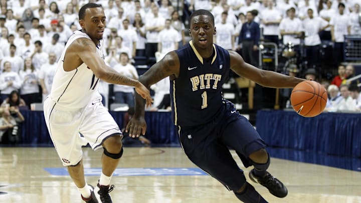 Mar 03, 2012; Storrs, CT, USA; Pittsburgh Panthers guard Tray Woodall (1) drives the ball in the first half against Connecticut Huskies guard Ryan Boatright (11) at Gampel Pavilion. Mandatory Credit: David Butler II-Imagn Images