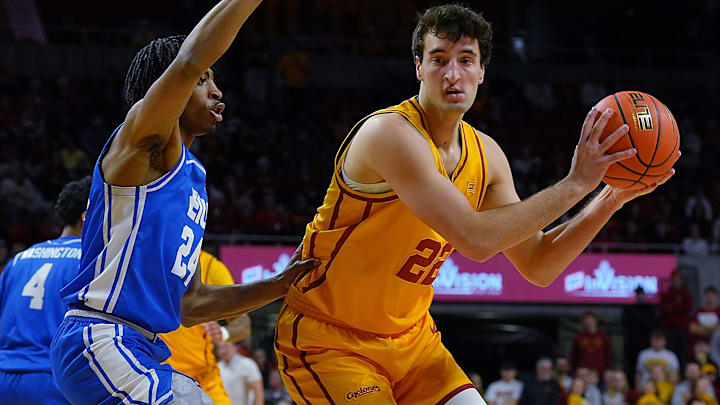 Iowa State Cyclones forward Milan Momcilovic (22) looks for a drive around Eastern Illinois Panthers forward Terry McMorris (24) during the first half on December 14, 2025, at Hilton Coliseum in Ames, Iowa.