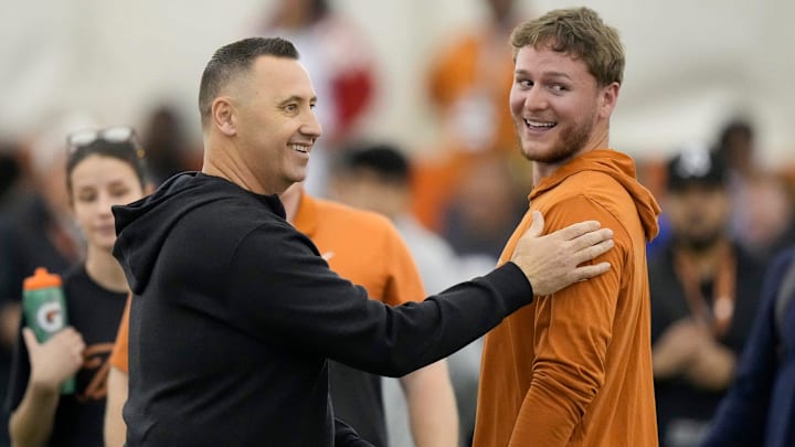 Head coach Steve Sarkisian greets quarterback Quinn Ewers who threw passes to receivers at Texas Longhorns Football Pro Day at Frank Denius Fields Wednesday March 20, 2024. Head coach Steve Sarkisian greets quarterback Quinn Ewers who threw passes to receivers at Texas Longhorns Football Pro Day at Frank Denius Fields Wednesday March 20, 2024.