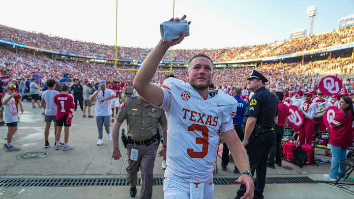Texas Longhorns quarterback Quinn Ewers (3) wavies to Oklahoma Sooners fans as he walks off the field after a win over 34-3 in the Red River Rivalry Football Game at the Cotton Bowl Stadium in Dallas, TX on Saturday Oct. 12, 2024.