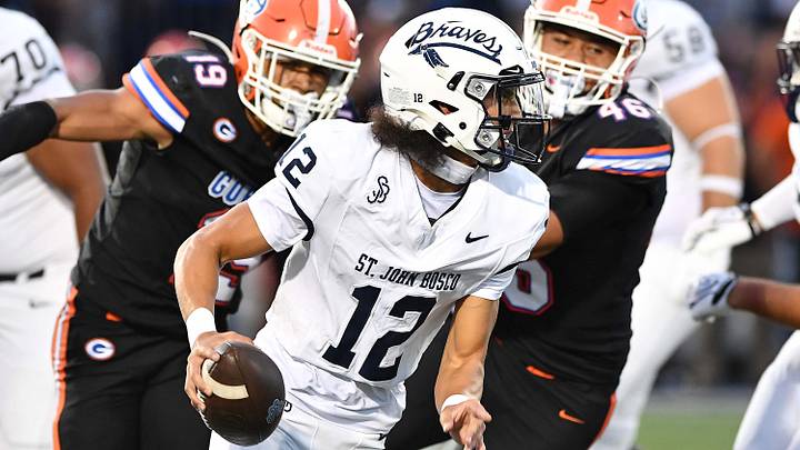 St. John Bosco quarterback Koa Malau'ulu looks for a receiver against Bishop Gorman during Gorman's 38-28 season opening victory.. St. John Bosco quarterback Koa Malau'ulu looks for a receiver against Bishop Gorman during Gorman's 38-28 season opening victory..