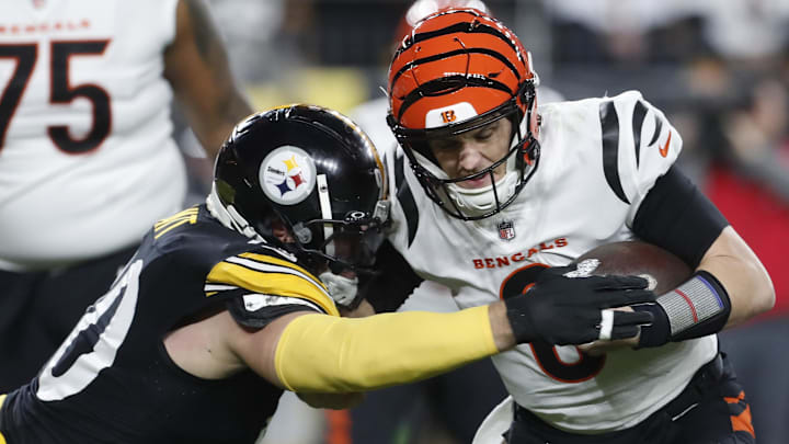 Dec. 23, 2023; Pittsburgh, Pennsylvania, USA;  Pittsburgh Steelers linebacker T.J. Watt (90) sacks Cincinnati Bengals quarterback Jake Browning (6) during the second quarter at Acrisure Stadium.
