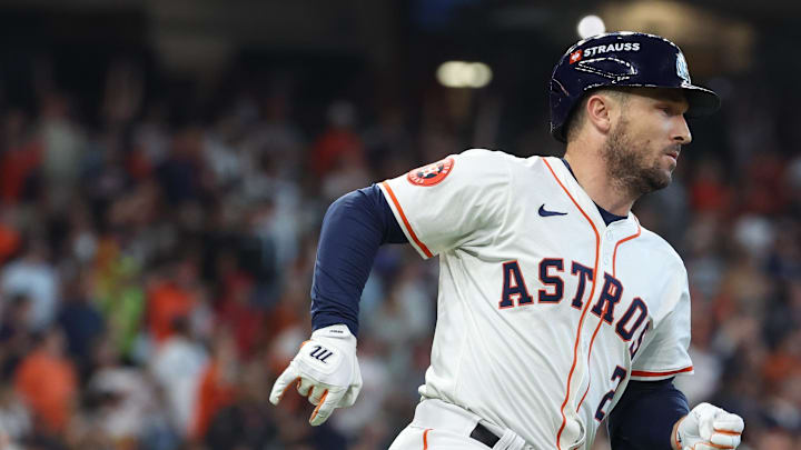 Oct 1, 2024; Houston, Texas, USA; Houston Astros third base Alex Bregman (2) hits a single against the Detroit Tigers in game one of the Wild Card round for the 2024 MLB Playoffs at Minute Maid Park. Mandatory Credit: Troy Taormina-Imagn Images