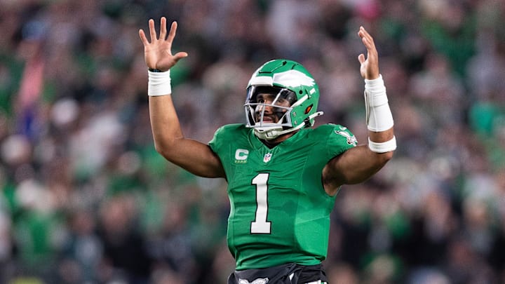Philadelphia Eagles quarterback Jalen Hurts (1) reacts to Saquon Barkley (not pictured) touchdown run against the Jacksonville Jaguars during the second quarter at Lincoln Financial Field.