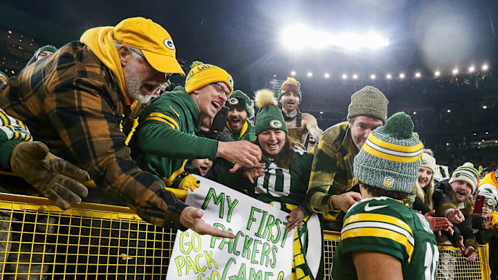 Green Bay Packers quarterback Jordan Love (10) celebrates with fans after defeating the Chicago Bears on Sunday, January 7, 2024, at Lambeau Field in Green Bay, Wis. The Packers won the game, 17-9, to clinch an NFC playoff berth.