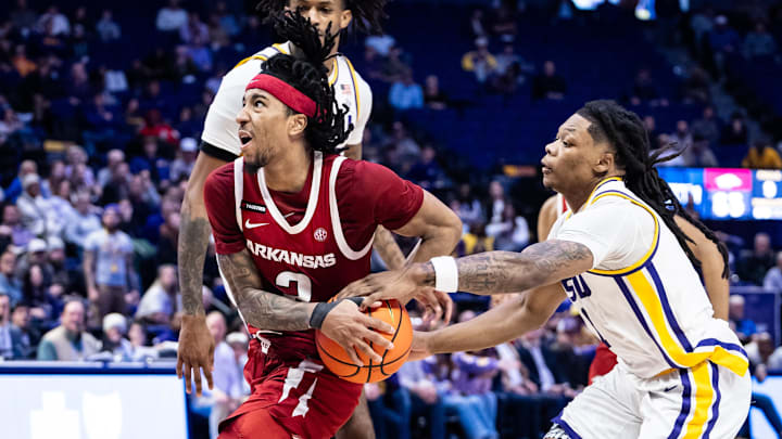 LSU Tigers guard Jordan Sears (1) attempts to steal the ball from Arkansas Razorbacks guard Boogie Fland (2) during the second half at Pete Maravich Assembly Center. LSU Tigers guard Jordan Sears (1) attempts to steal the ball from Arkansas Razorbacks guard Boogie Fland (2) during the second half at Pete Maravich Assembly Center.