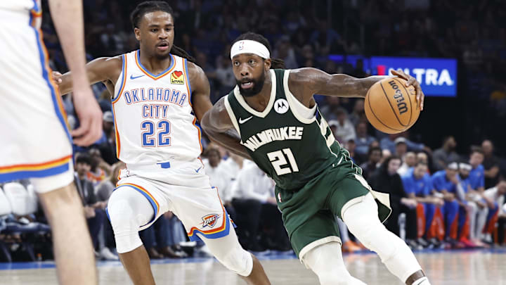 Apr 12, 2024; Oklahoma City, Oklahoma, USA; Milwaukee Bucks guard Patrick Beverley (21) drives to the basket beside Oklahoma City Thunder guard Cason Wallace (22) during the second quarter at Paycom Center. Mandatory Credit: Alonzo Adams-Imagn Images