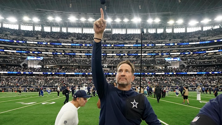 Dallas Cowboys head coach Brian Schottenheimer gestures to fans after the game against the New York Giants Dallas Cowboys head coach Brian Schottenheimer gestures to fans after the game against the New York Giants