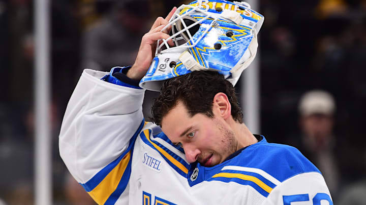 Dec 4, 2025; Boston, Massachusetts, USA; St. Louis Blues goaltender Jordan Binnington (50) slips on his goalie mask during the third period against the Boston Bruins at TD Garden. Mandatory Credit: Bob DeChiara-Imagn Images