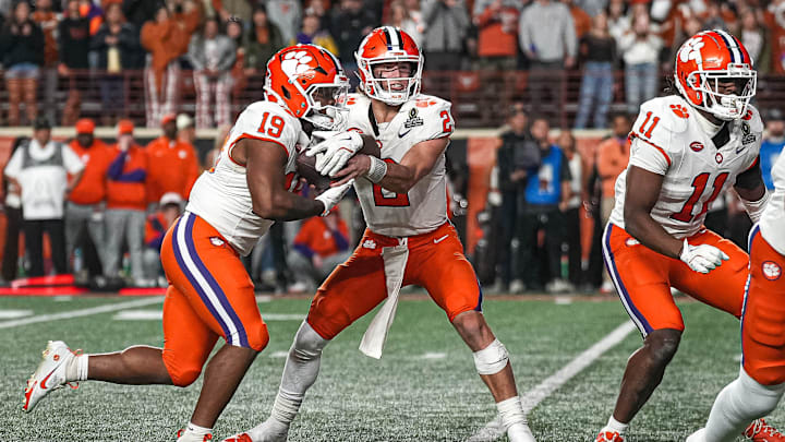 Clemson quarterback Cade Klubnik (2) hands the ball off to running back Keith Adams Jr. (19) during the game against the Texas Longhorns in the first round of the College Football Playoffs at Darrell K Royal-Texas Memorial Stadium on Saturday, Dec. 21, 2024.