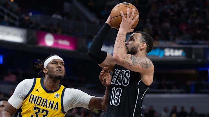 Mar 20, 2025; Indianapolis, Indiana, USA; Brooklyn Nets guard Tyrese Martin (13) shoots the ball while Indiana Pacers center Myles Turner (33) defends in the second half at Gainbridge Fieldhouse. Mandatory Credit: Trevor Ruszkowski-Imagn Images