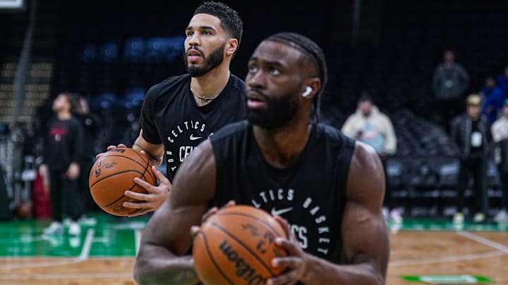 Jan 27, 2025; Boston, Massachusetts, USA; Boston Celtics forward Jayson Tatum (0) and guard Jaylen Brown (7) warm up before the start of the game against the Houston Rockets at TD Garden. Mandatory Credit: David Butler II-Imagn Images