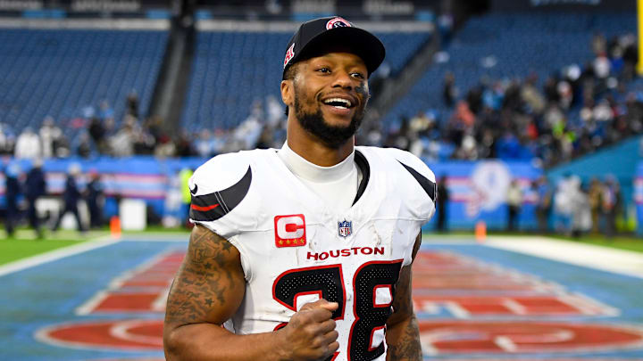 Jan 5, 2025; Nashville, Tennessee, USA;  Houston Texans running back Joe Mixon (28) smiles as he leaves the field against the Tennessee Titans during the second half at Nissan Stadium. Mandatory Credit: Steve Roberts-Imagn Images