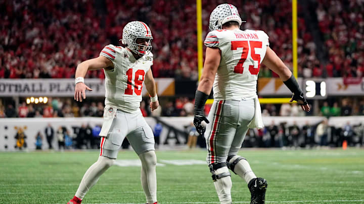 Ohio State Buckeyes quarterback Will Howard (18) celebrates a touchdown with offensive lineman Carson Hinzman (75) against Notre Dame Fighting Irish in the second quarter during the College Football Playoff National Championship at Mercedes-Benz Stadium in Atlanta on January 20, 2025.