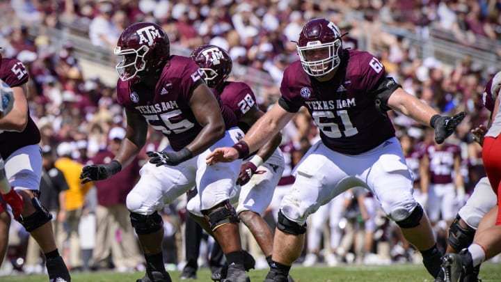 Sep 18, 2021; College Station, Texas, USA; Texas A&M Aggies offensive lineman Kenyon Green (55) and offensive lineman Bryce Foster (61) in action during the game between the Texas A&M Aggies and the New Mexico Lobos at Kyle Field. Mandatory Credit: Jerome Miron-USA TODAY Sports