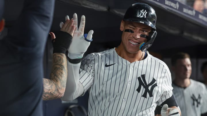 Aug 23, 2024; Bronx, New York, USA; New York Yankees center fielder Aaron Judge (99) celebrates his solo home run with teammates during the sixth inning against the Colorado Rockies at Yankee Stadium. Mandatory Credit: Vincent Carchietta-USA TODAY Sports Aug 23, 2024; Bronx, New York, USA; New York Yankees center fielder Aaron Judge (99) celebrates his solo home run with teammates during the sixth inning against the Colorado Rockies at Yankee Stadium. Mandatory Credit: Vincent Carchietta-USA TODAY Sports