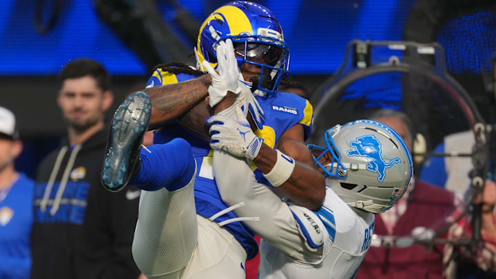Los Angeles Rams wide receiver Davante Adams (17) catches a pass against Detroit Lions cornerback D.J. Reed (4). Los Angeles Rams wide receiver Davante Adams (17) catches a pass against Detroit Lions cornerback D.J. Reed (4).
