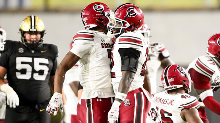 Nov 9, 2024; Nashville, Tennessee, USA;  South Carolina Gamecocks linebacker Bam Martin-Scott (22) celebrates the sack of Vanderbilt Commodores quarterback Diego Pavia (2) with defensive back Nick Emmanwori (7) at FirstBank Stadium. Mandatory Credit: Steve Roberts-Imagn Images