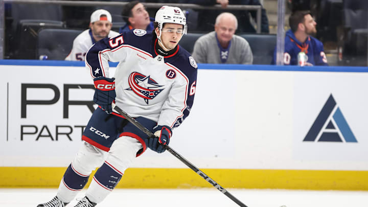 Jan 20, 2025; Elmont, New York, USA; Columbus Blue Jackets center Luca Del Bel Belluz (65) controls the puck in the second period against the New York Islanders at UBS Arena. Mandatory Credit: Wendell Cruz-Imagn Images