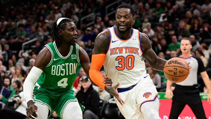Dec 8, 2023; Boston, Massachusetts, USA;  New York Knicks forward Julius Randle (30) moves to the basket  while being defended by Boston Celtics guard Jrue Holiday (4) during the first half at TD Garden. Mandatory Credit: Eric Canha-USA TODAY Sports