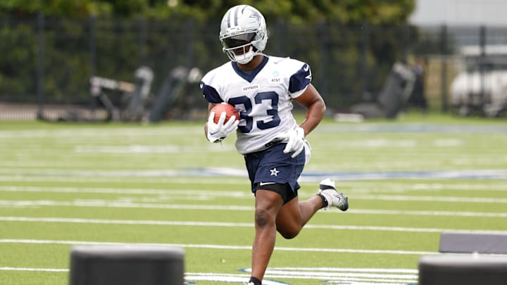Dallas Cowboys running back Javonte Williams goes through a drill during practice.