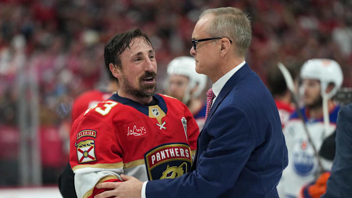 Florida Panthers center Brad Marchand (63) speaks to head coach Paul Maurice after winning game six of the 2025 Stanley Cup Final against the Edmonton Oilers at Amerant Bank Arena.