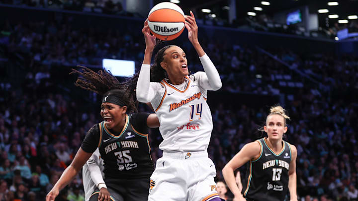 Sep 17, 2025; Brooklyn, New York, USA; Phoenix Mercury forward DeWanna Bonner (14) and New York Liberty center Jonquel Jones (35) during game two of round one for the 2025 WNBA Playoffs at Barclays Center. Mandatory Credit: Wendell Cruz-Imagn Images