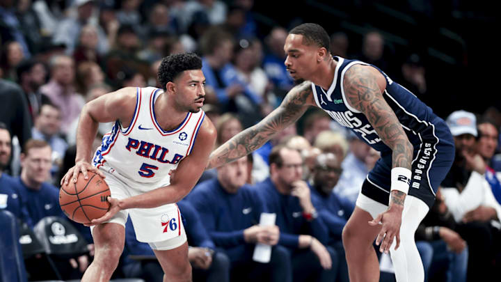 Mar 16, 2025; Dallas, Texas, USA;  Philadelphia 76ers guard Quentin Grimes (5) looks to score as Dallas Mavericks forward P.J. Washington (25) defends during the first half at American Airlines Center. Mandatory Credit: Kevin Jairaj-Imagn Images