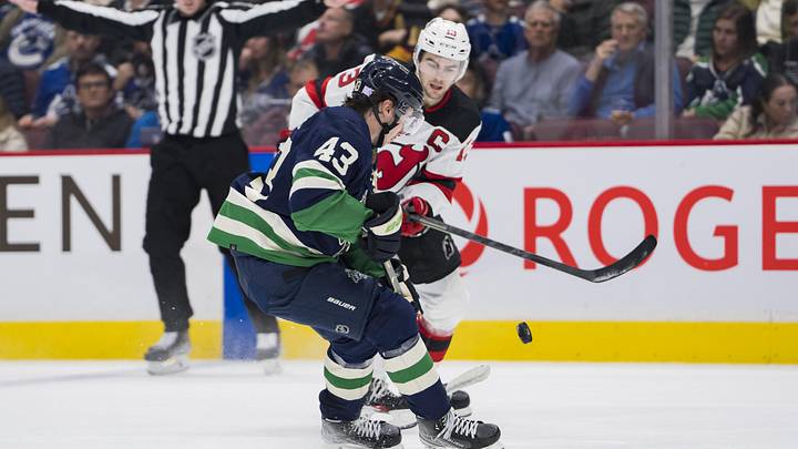 Minnesota Wild defenseman Quinn Hughes (43) defends against New Jersey Devils forward Nico Hischier (13) in the second period at Rogers Arena. Mandatory Credit: Bob Frid-Imagn Images Minnesota Wild defenseman Quinn Hughes (43) defends against New Jersey Devils forward Nico Hischier (13) in the second period at Rogers Arena. Mandatory Credit: Bob Frid-Imagn Images