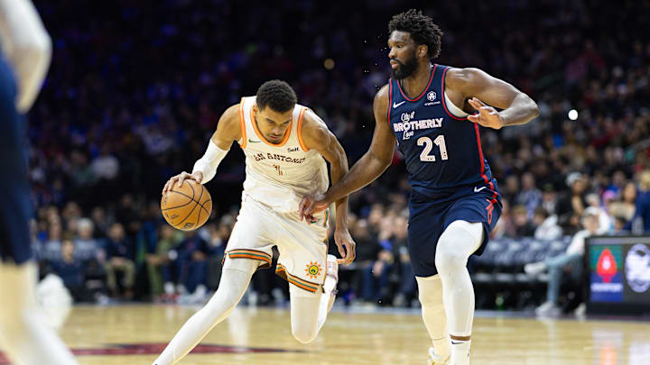 Jan 22, 2024; Philadelphia, Pennsylvania, USA; San Antonio Spurs center Victor Wembanyama (1) dribbles the ball against Philadelphia 76ers center Joel Embiid (21) during the third quarter at Wells Fargo Center. Mandatory Credit: Bill Streicher-Imagn Images