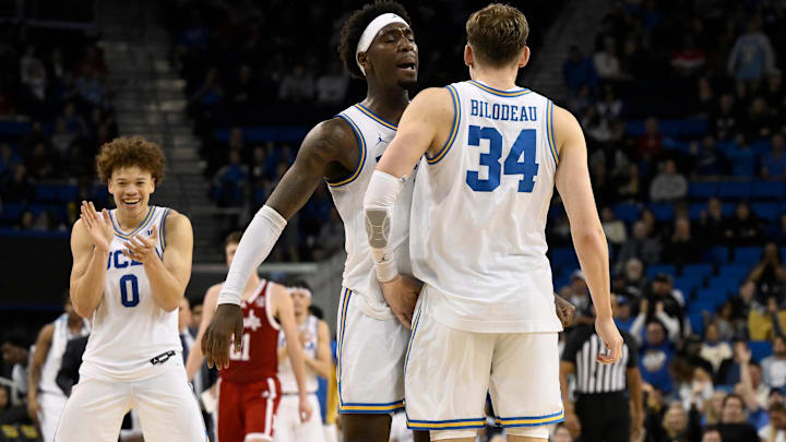Mar 3, 2026; Los Angeles, California, USA; UCLA Bruins forward Tyler Bilodeau (34) chest dumps teammate Eric Dailey Jr. (3) after hitting a 3-point shot during the second} half at Pauley Pavilion presented by Wescom Financial. Mandatory Credit: Robert Hanashiro-Imagn Images