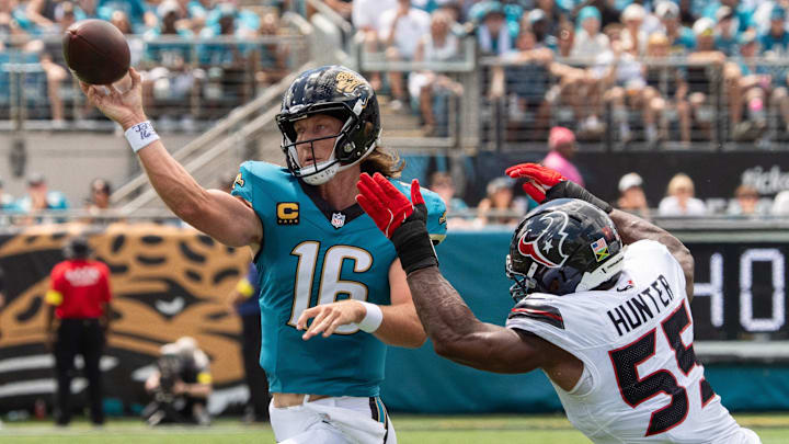 Jacksonville Jaguars quarterback Trevor Lawrence (16) unloads the ball while being pursued by Houston Texans defensive end Danielle Hunter (55) during the first quarter between the Houston Texans and the Jacksonville Jaguars Sunday September 21, 2025 at EverBank Stadium in Jacksonville, Fla. [Doug Engle/Florida Times-Union]