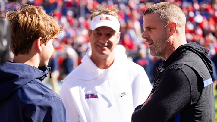 Florida Gators head coach Billy Napier talks with Mississippi Rebels head coach Lane Kiffin before the start of the game at Ben Hill Griffin Stadium in Gainesville, FL on Saturday, November 23, 2024. [Doug Engle/Gainesville Sun]