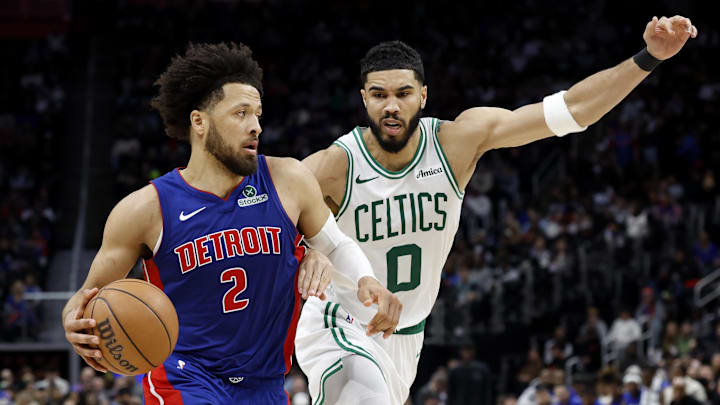 Feb 26, 2025; Detroit, Michigan, USA;  Detroit Pistons guard Cade Cunningham (2) dribbles on Boston Celtics forward Jayson Tatum (0) in the second half at Little Caesars Arena. Mandatory Credit: Rick Osentoski-Imagn Images